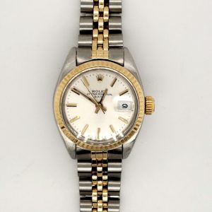 Beautiful ladies Rolex 14 karat yellow and Stainless steel. Model # 6917 ,automatic date, silver dial with stick hour markers. Fluted bezel and acrylic crystal, yr 78-79 jubilee bracelet serviced with one year warranty