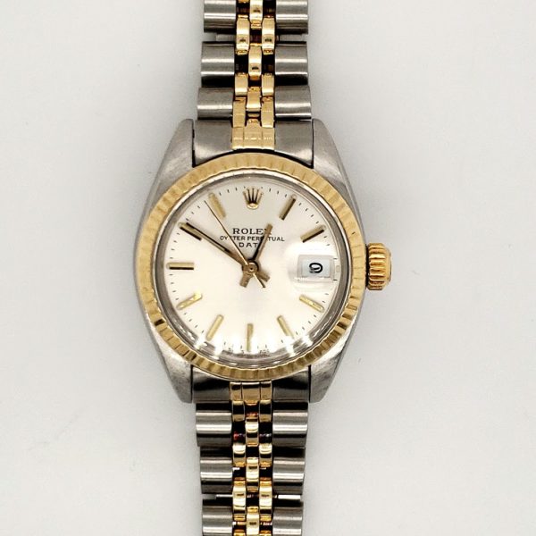 Beautiful ladies Rolex 14 karat yellow and Stainless steel. Model # 6917 ,automatic date, silver dial with stick hour markers. Fluted bezel and acrylic crystal, yr 78-79 jubilee bracelet serviced with one year warranty