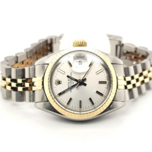 Beautiful ladies Rolex 14 karat yellow and Stainless steel. Model # 6917 ,automatic date, silver dial with stick hour markers. Fluted bezel and acrylic crystal, yr 78-79 jubilee bracelet serviced with one year warranty