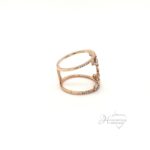 Stunning 14 karat rose gold scattered diamond gap ring set with round and baguette at .52 ctw si/g-h color. size 7, 3.9 grams 18 mm wide.