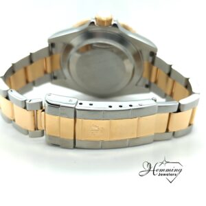 Underside view of the 2008 Rolex Submariner Bluesy 16613, detailing the steel/18k gold Oyster bracelet links and the solid steel screw-down case back.